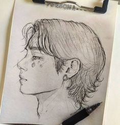 a pencil drawing of a boy with short hair