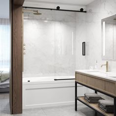 a bathroom with two sinks and a bathtub next to a large mirror on the wall