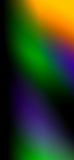 a blurry image of an orange, yellow and green color scheme with black background