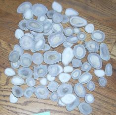 several pieces of glass sitting on top of a wooden table next to a notepad