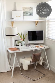 a white desk with a computer on top of it