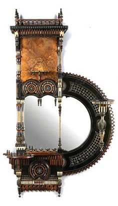 an ornate mirror and shelf are on display