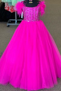 a pink dress on display in a store