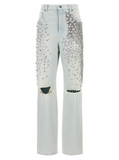 a pair of white jeans with silver sequins on the side and holes in the back