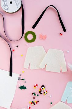 craft supplies laid out on a pink surface