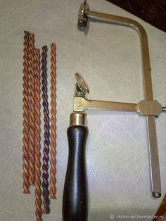 several different types of braiding tools on a white table cloth next to each other