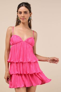 The undeniable party presence of the Lulus Sleek Dedication Hot Pink Satin Plisse Cutout Tiered Mini Dress means that it was made to own the dance floor! Luxe, plisse-pleated woven satin shapes this stunning dress that features a sleeveless bodice with an alluring V-neckline and adjustable spaghetti straps. The high, empire-style waist features trendy twin cutouts at the sides, all atop a tiered A-line skirt that finishes at a too-cute mini hem. Hidden back zipper/clasp. Fit: This garment fits t Pink And Orange Dress, Hot Pink Satin Dress, Pink Wedding Guest Dresses, Cute Flowy Dresses, Casual Wedding Guest Dresses, Semi Dresses, Lover Dress, Pink Satin Dress, Tiered Mini Dress