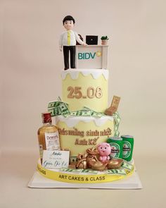 a cake with a man standing on top of it