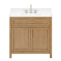 a bathroom vanity with white marble top and wooden cabinet doors, two faucets on each side