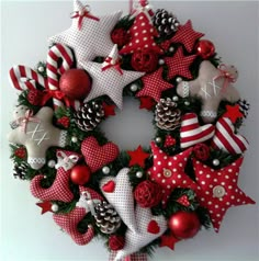 a christmas wreath with red and white decorations