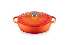 an orange casserole dish on a white background