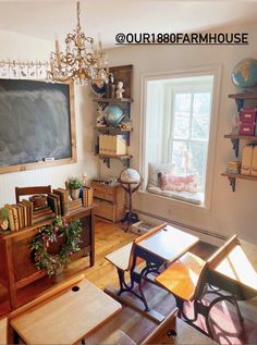 a living room filled with furniture and a chalkboard