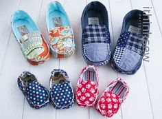 five pairs of shoes are lined up on the floor, all in different colors and patterns