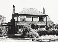 a black and white photo of a house