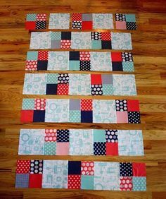 four blocks are laid out on the floor to make a quilt pattern for each block