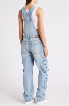 Cargo pockets and a baggy fit up the utilitarian appeal of these classic overalls cut from nonstretch denim with a light blue-wash finish. 32" inseam Square neck Adjustable buckle straps; side button closures Front slant pockets; back patch pockets; large chest patch pocket; cargo flap-patch pockets 100% cotton Machine wash, tumble dry Imported Utility High Rise Medium Wash Overalls, Utility Style High Rise Medium Wash Overalls, Utility Overalls In Washed Blue With Pockets, Utility Denim Overalls, Denim Utility Overalls, Utility High Rise Overalls With Pockets, Denim Straight Leg Utility Overalls, Utility Style Denim Overalls With Straight Leg, Utility Denim Overalls With Straight Legs