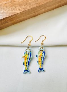 Go fishing with these super cute handmade polymer clay earrings. These are very lightweight, comfortable and easy to maintain. These are hand painted and sealed with enamel paints. The metals are gold plated stainless and nickel free. Sardine Earrings, Fish Earrings, Earrings Polymer Clay, Handmade Polymer Clay, Polymer Clay Earrings, Clay Earrings, Jewelry Earrings Dangle, Etsy Earrings, Dangle Drop Earrings