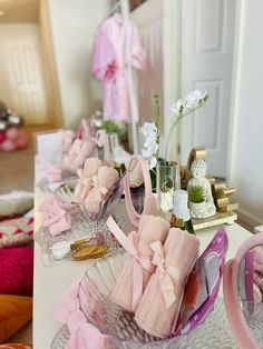 a table topped with lots of pink items