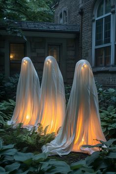 15 Spooky Diy Halloween Decorations You Must See Halloween Yard Ghost Decorations, Ghosts Hanging From Tree, Spooky Halloween House Exterior, Halloween Uplighting Outdoor, Haunted Porch Ideas Diy, Ghost In Trees Diy, Haunted Hike Ideas, Witchy Outdoor Decor Halloween, Diy Outdoor Haunted House Ideas