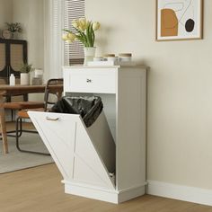 an open cabinet in the corner of a room