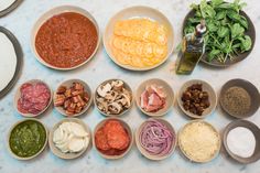 several bowls with different types of food in them