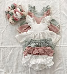 Get ready for your little girl to steal the show in this beautiful romper. She will fall in love with this cute ruffled sleeves, cross back, and bow design at the back and you will adore the layering design with bloomers shorts that make it easy to dress her up and down. This is one of the most popular styles, it's so versatile and stylish! Material: Cotton Kids Ruffle Dress, Lace Ruffle Dress, Criss Cross Dress, Pieces Of Clothing, Vintage Baby Girl, Baby Outfits