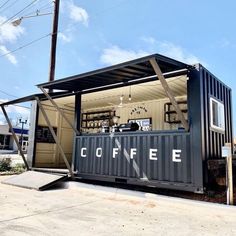 a coffee shop sitting on the side of a road