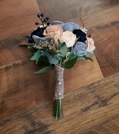 a bridal bouquet on a wooden floor