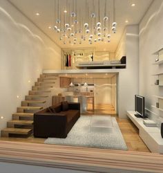 a living room filled with furniture next to a stair case and a flat screen tv