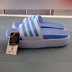 Brand New Addillettes, Blue Adidas Blue Sandals For Spring, Spring Blue Adidas Sandals, Light Blue Flat Slides For Spring, Spring Light Blue Flat Slides, Adidas Blue Slip-on Sandals, Adidas Blue Slip-on Slides, Blue Synthetic Slides For Spring, Trendy Blue Slides For Spring, Blue Adidas Synthetic Slides