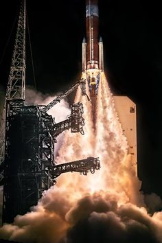 the space shuttle lifts off into the sky