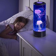 The Jellyfish Aquarium features 5 LED color options: Red, Green, Blue, Purple, and Pink. Pick the color that matches your home's personality, or let the auto color-switching function do the magic for you!? Create a "Peace of Mind" atmosphere by switching the Aquarium on. Even the most energetic kids will not be able to resist its calming atmosphere! Simply add distilled or tap cold water into the tank, put the jellyfish in, plug it into a USB port or insert 3 AA batteries, and press the ON butto Desktop Aquarium, Jellyfish Illustration, Jellyfish Photography, Jellyfish Tank, Aquarium Lamp, Jellyfish Aquarium, Jellyfish Light, Jellyfish Craft, Jellyfish Lamp