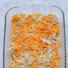 a casserole dish filled with cheese and meat