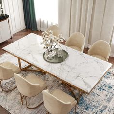 a marble dining table surrounded by beige chairs