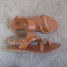 Ancient Greek Sandals Alethea Women's Leather Sandals Size 8 Tan/Brown(Nature) Handmade In Greece Following The Natural Curves Of Your Foot, This Sandal's Organic Lines Aim To Bring Out The Beauty Of Your Own Shape, Just As The Leather It Is Made Of Ages And Colours As It Softens On Your Foot. A Solid Over-Foot Strap Provides All The Security You Need, While Finer Interlocking Straps Loop From Toe Across Foot And Behind Your Heel To Make Every Step Feel Light And Effortless. Wear Will A Floaty M Brown T-strap Sandals With Leather Lining, Brown T-strap Sandals With Leather Sole, Brown Nature, Women's Leather Sandals, Ancient Greek Sandals Eleftheria, Brown Adjustable T-strap Sandals With Cushioned Footbed, Brown Adjustable T-strap Sandals With Leather Sole, Organic Lines, Ancient Greek Sandals