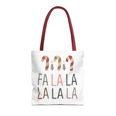 a tote bag with the words fala la la on it and candy canes