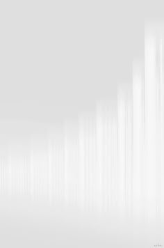 an abstract white background with vertical lines in the center and one line at the bottom