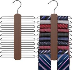 three ties are hanging on clothes pins and hangers