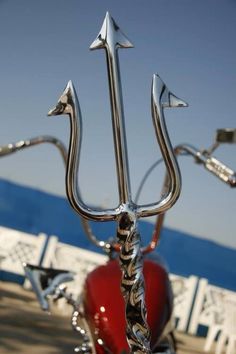 a close up of a motorcycle handlebars with an anchor on it's side