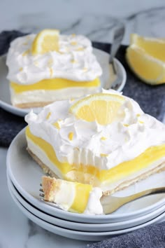 two plates with slices of lemon meringue pie on them