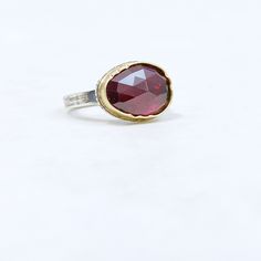 Silver & Stone Ring, Size 7.5 - This handmade ring features a rose-cut rhodolite garnet set in 18k gold chased bezel on a forged sterling silver shank, slightly squared for comfort.<br><br>Available in size 7.5. Silver Stone Ring, Artful Home, Rhodolite Garnet, Ring Size 7, Stone Ring, Ring Bracelet, Rose Cut, Handmade Ring, Stone Rings