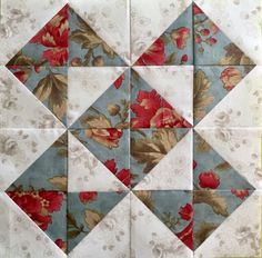 the block is made up of many different colors and patterns, including red flowers on blue