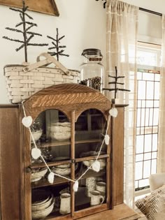 an old china cabinet is decorated with christmas decorations