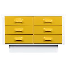 a yellow and white dresser with four drawers