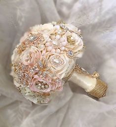 a bridal bouquet with pearls and flowers