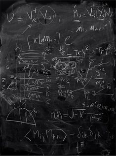 a blackboard with many calculations written on it