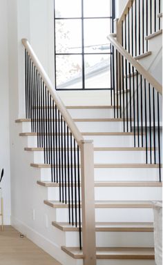 there is a white and black staircase in the house