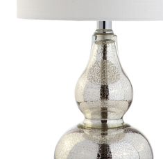 a silver table lamp with a white shade on the top and bottom part of it