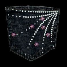 the back pocket of a pair of jeans with pink and white flowers embroidered on it