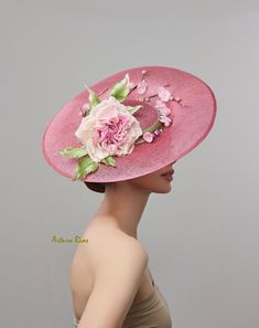 From my 2024 Collection Pretty Large Disk Sinamay hat made in Mauve/Pink tone, embellished with a pretty custom-made Silk rose in Ivory/pink/mauve Silk with crystals, green satin leaves and Vintage silk cherry blossoms. Seated on a velvet headband. All hats are hand made to order, please allow 1-2 weeks, if this is a rush order, please contact me first. All sales are final. Elegant Rose Party Hat, Elegant Rose Hat For Kentucky Derby, Elegant Rose Fascinator For Kentucky Derby, Pink Flat Brim Fascinator For Spring, Flower Hat For Royal Ascot Races, Flower Hats For Kentucky Derby Races, Pink Hat With Handmade Flowers And Curved Brim, Pink Elegant Flat Brim Fascinator, Elegant Pink Flat Brim Fascinator